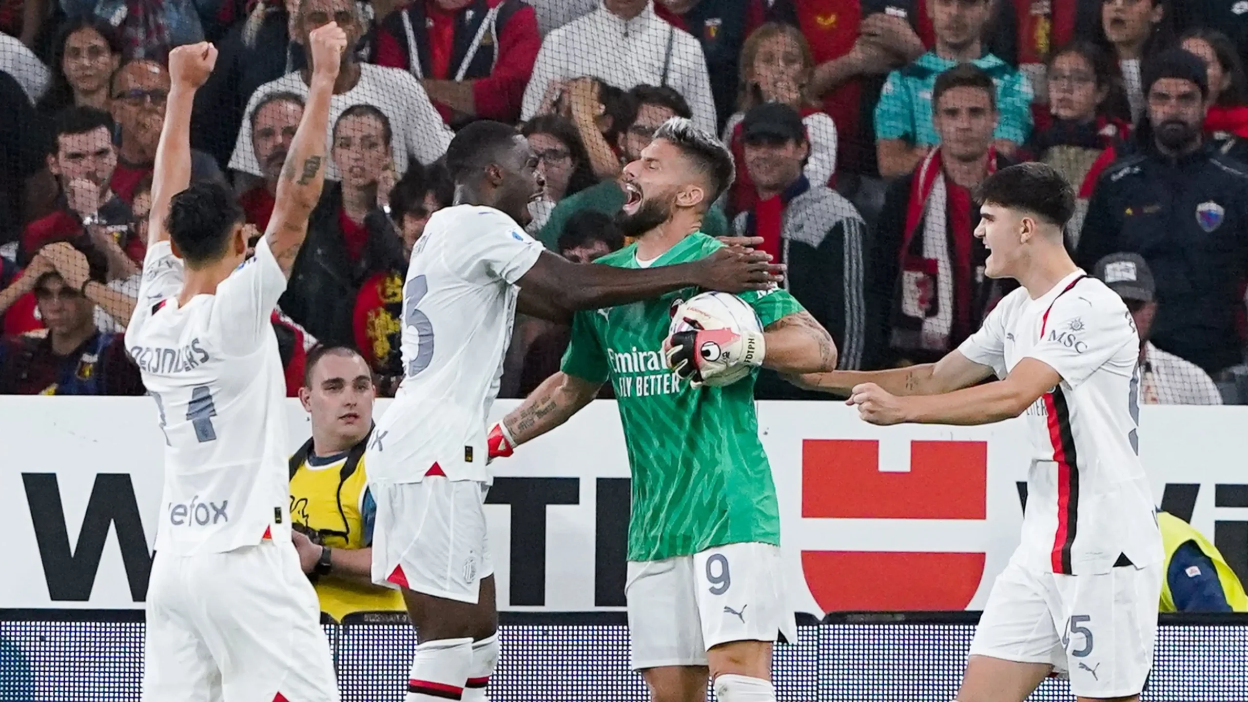 AC Milan defeated Genoa to go top of Serie A despite playing the last seven minutes of their game with forward Olivier Giroud in goal as both teams' goalkeepers were sent off.