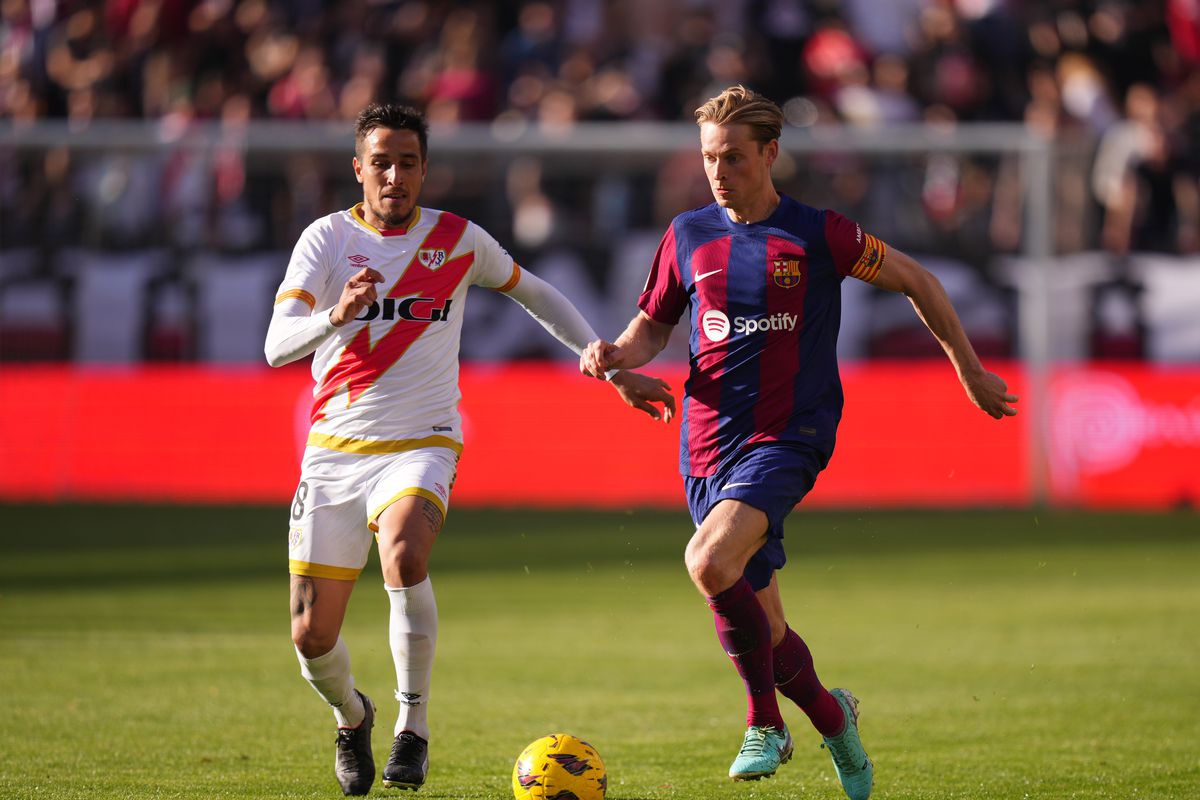 Barcelona are third in La Liga after a late own goal salvaged a tie at Rayo Vallecano.