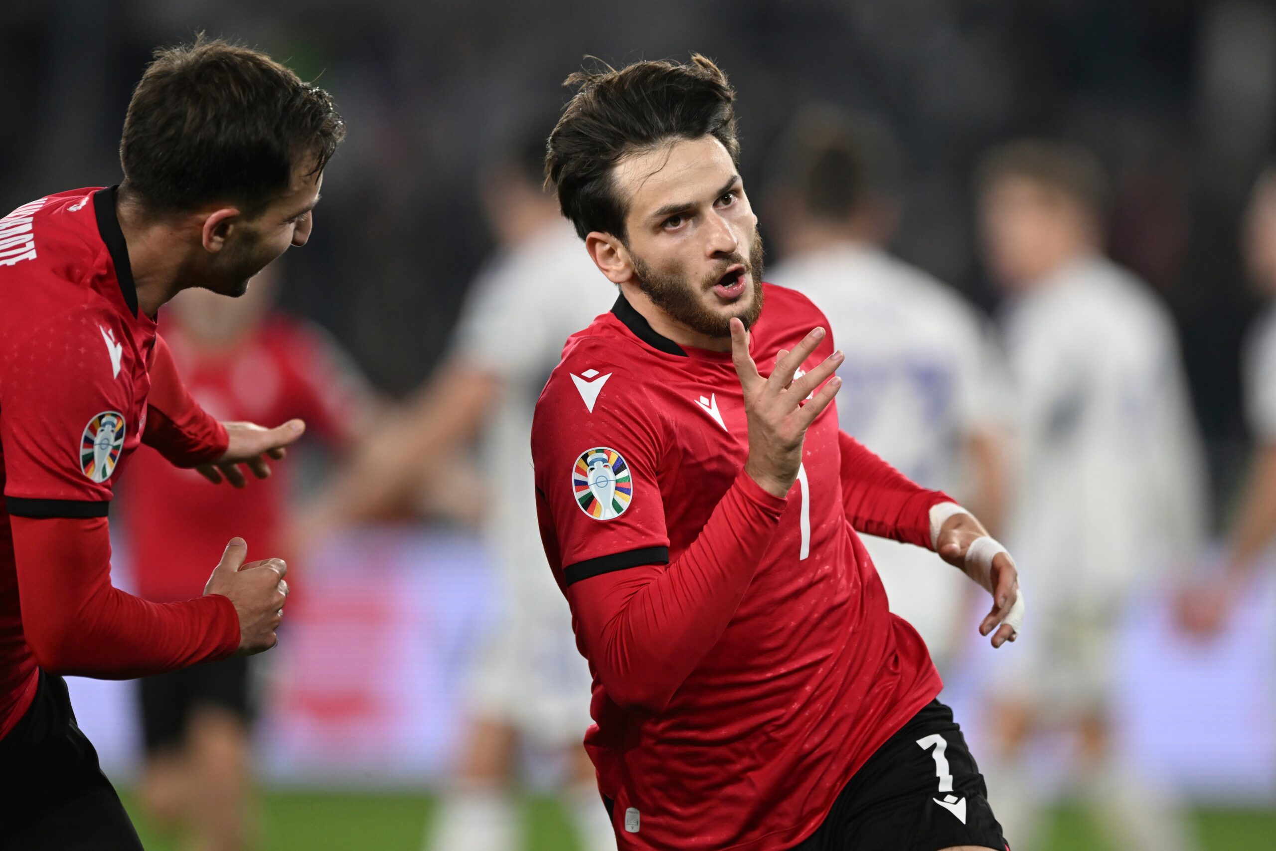 Lawrence Shankland's stoppage-time leveler salvaged a point for Scotland as they kept their slim hopes of topping their Euro 2024 qualifying group alive with a late tie in Georgia.