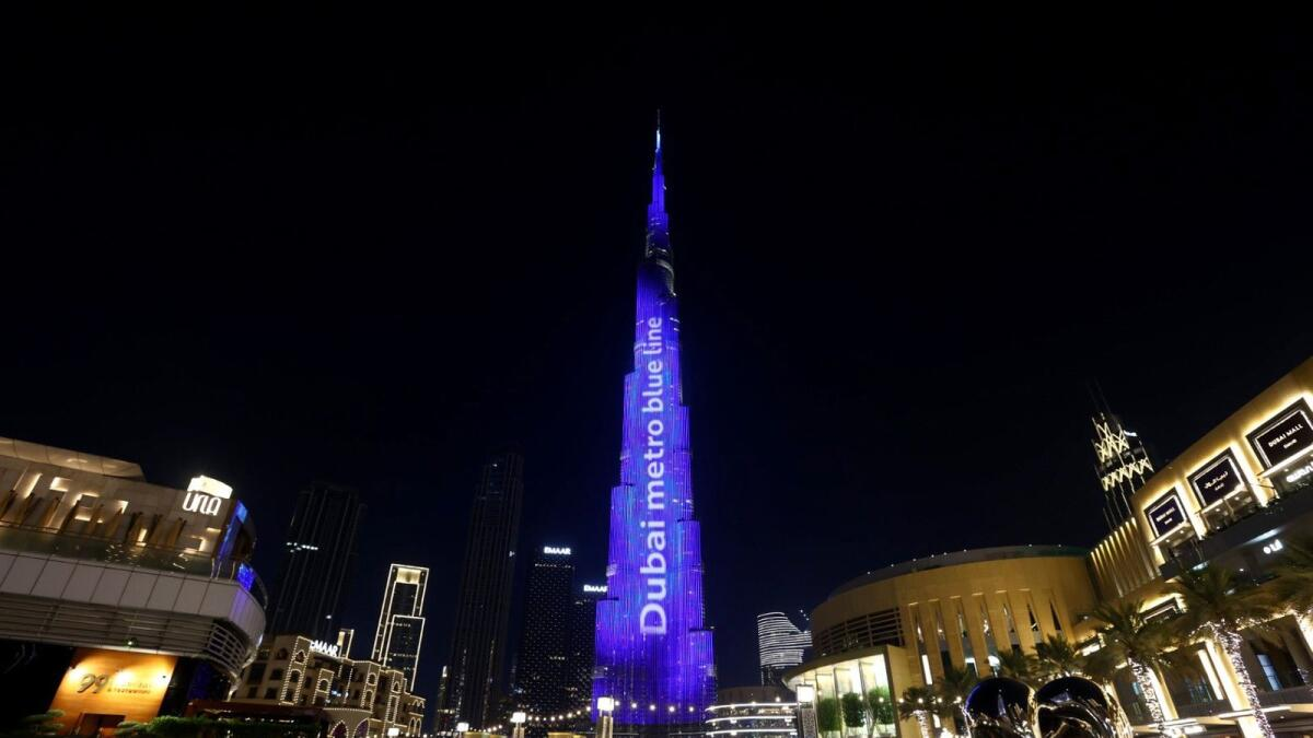 The skyscraper was a dazzling blue colour, symbolising the start of the 'Blue Line' extension project.