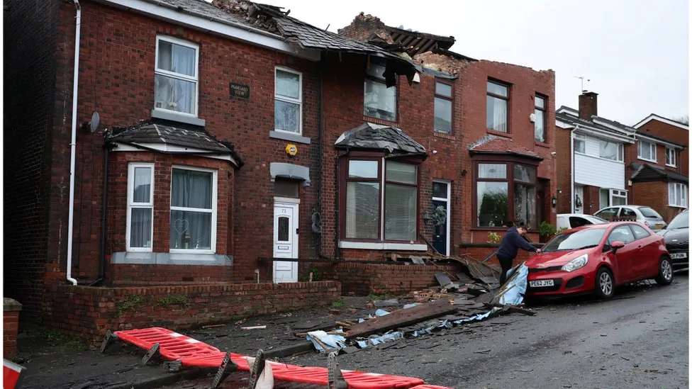 Roofs were torn off homes, trees bumbled down, and walls tumbled as a small "tornado" tore through Greater Manchester during Storm Gerrit.