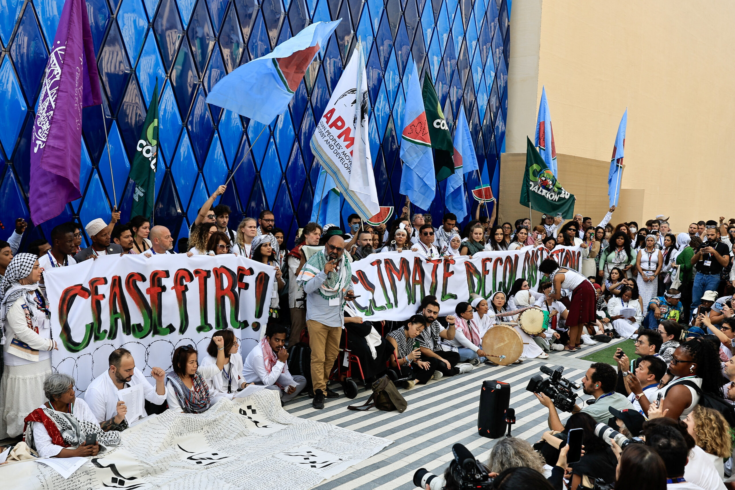 Dozens of activists hold pacifist protests relating the Israel-Gaza conflict to climate justice.